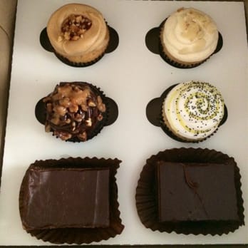 Bake My Day - From left to right- PB&J cupcake, Amaretto cupcake, Turtle cupcake, lemon poppyseed cupcake, and two peanut butter brownies. - Bakeries Near Me - Green Bay, Wisconsin Bake My Day - From left to right- PB&J cupcake, Amaretto cupcake, Turtle cupcake, lemon poppyseed cupcake, and two peanut butter brownies. - Bakeries Near Me - Green Bay, Wisconsin