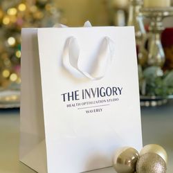 Level Up Logo - Foil-printed shopping bags for spa company.