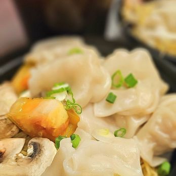 Thailicious - a plate of dumplings and vegetables - Thai Near Me - North Charleston, South Carolina