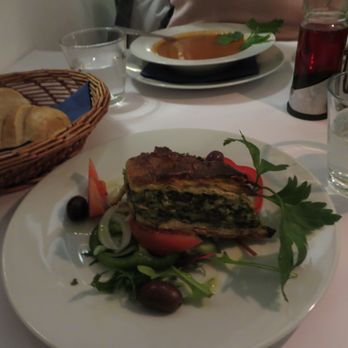 Restaurant Akropolis - Terrible photo, but great spanakopita. Tomatoes underneath were also the best I've had in months, they don't exist in the US in December - Greek Near Me - Frederiksberg, 84