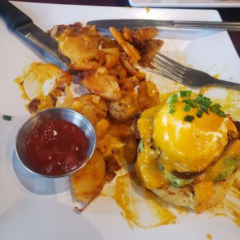 Taylor Sam's - Eggs Benedict with chorizo and jalapeño biscuit (half eaten) - Coffee & Tea Near Me - Brick, New Jersey