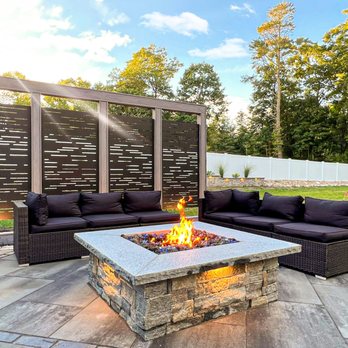 Amazing Garden & Construction - a patio with a fire pit - Patio Coverings Near Me - Needham, Massachusetts