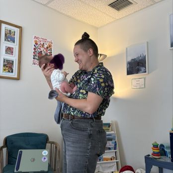 Wellspring Midwifery - Lizz, the midwife, holding baby at postpartum visit. - Prenatal/Perinatal Care Near Me - Federal Way, Washington Wellspring Midwifery - Lizz, the midwife, holding baby at postpartum visit. - Prenatal/Perinatal Care Near Me - Federal Way, Washington