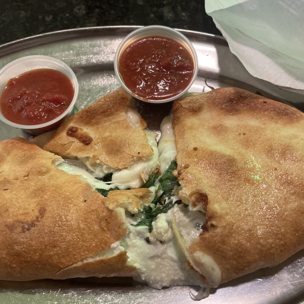 Calzone with Italian sausage and spinach Calzone with Italian sausage and spinach