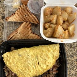Essence House Cafe - Meat lovers omelette, honey wheat toast and delicious potato cubes