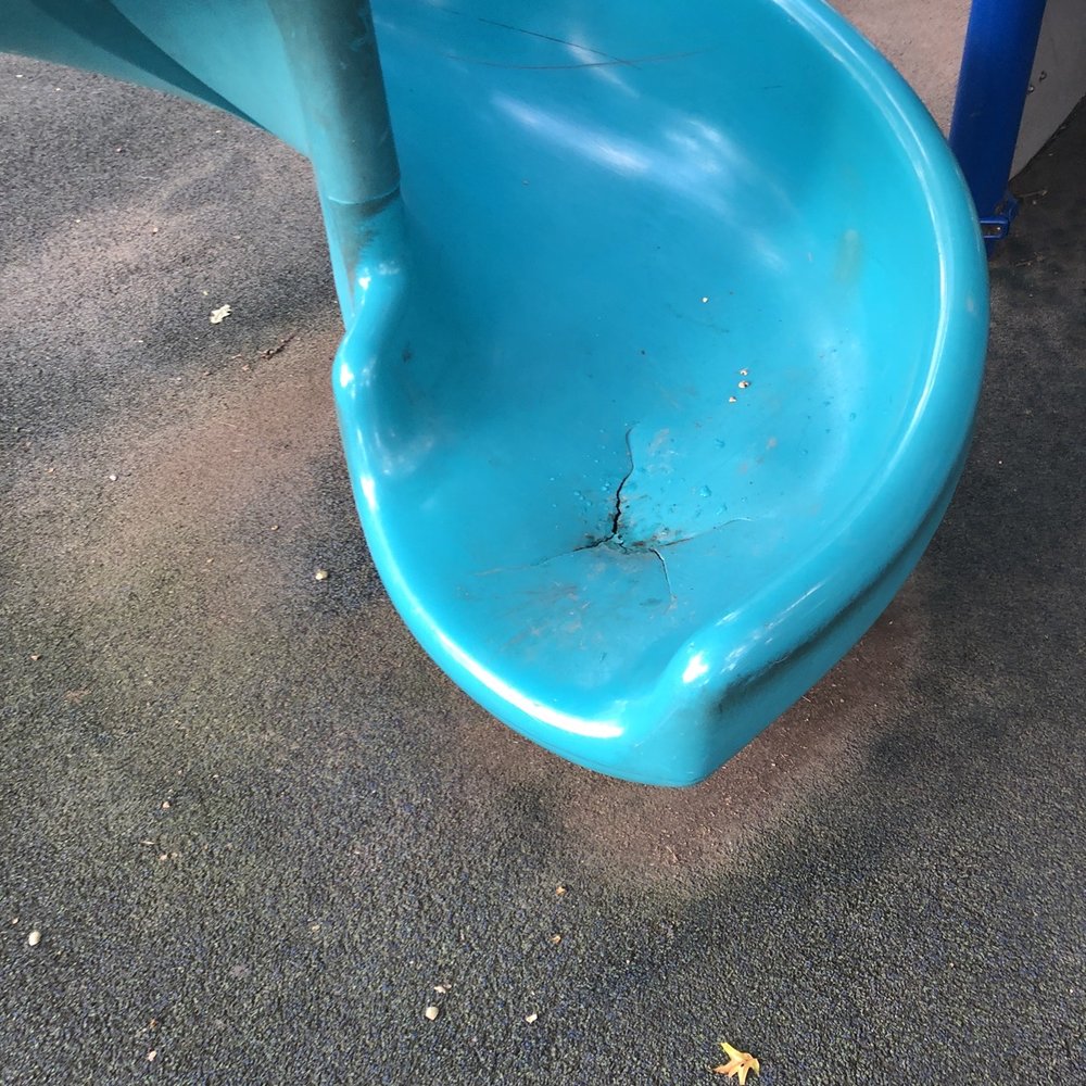 The bottom of the broken slide that hasn't been fixed for a while. The bottom of the broken slide that hasn't been fixed for a while.