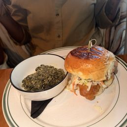 Fish sandwich and spinach Fish sandwich and spinach