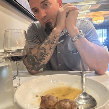 Cara Mia Restaurant - My Fiancé enjoying the stuffed mushrooms - Italian Near Me - Floral Park, New York