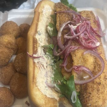 Fish & Cajun Crab - This was one fillet of a two piece catfish dinner with some great hush puppies!! We took it home and made a Poboy out of it! Good Stuff! - Seafood Near Me - Winder, Georgia Fish & Cajun Crab - This was one fillet of a two piece catfish dinner with some great hush puppies!! We took it home and made a Poboy out of it! Good Stuff! - Seafood Near Me - Winder, Georgia