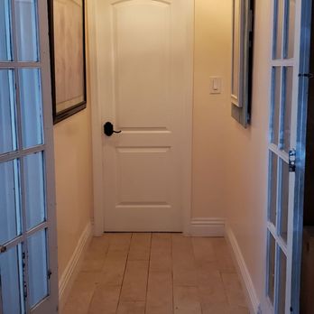 Majesty Construction - Entrance to our half bathroom. For decades my parents never fixed that chandelier well, I did and made it look beautiful.. - General Contractors Near Me