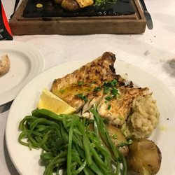 Restaurante Estrela do Mar - Seabass (comes on a separate tray then placed on plate, can be made to share) another fish in back.