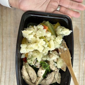 The Clean Eatery - a bowl of food with a wooden spoon - Food Delivery Services Near Me - Little Rock, Arkansas