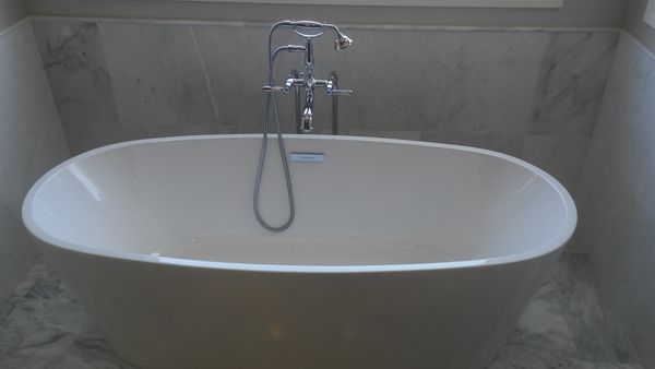 Bathtub - Installed finished work, soaking tub with shower trims. Bathtub - Installed finished work, soaking tub with shower trims.