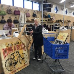 American Thrift Stores - Customers checking out with all their great savings!