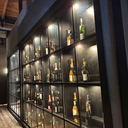 Bike Shed Moto Co - Los Angeles - Top shelf spirits on display.