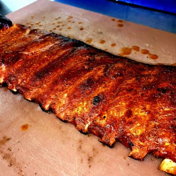 Jed’s - a rack of ribs on a cutting board - Barbeque Near Me - Madison Heights, Virginia Jed’s - a rack of ribs on a cutting board - Barbeque Near Me - Madison Heights, Virginia