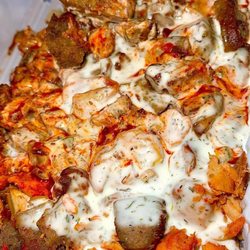 Sahara Grill Food Cart - Chicken and lamb over rice with hot sauce and white sauce.