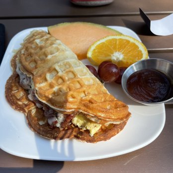 Urban Olive & Vine - Duck Bacon Stuffed Nordic Waffle (duck bacon swapped with regular bacon) - New American Near Me - Hudson, Wisconsin Urban Olive & Vine - Duck Bacon Stuffed Nordic Waffle (duck bacon swapped with regular bacon) - New American Near Me - Hudson, Wisconsin
