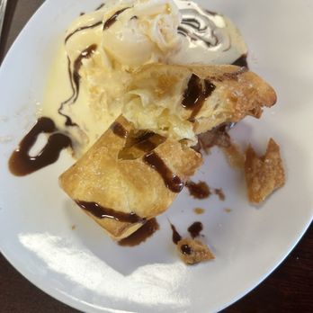 Tarascó - Dessert, custard filled, deep fried with a scoop of vanilla ice cream drizzled with chocolate syrup. Boom - Mexican Near Me - Albuquerque, New Mexico