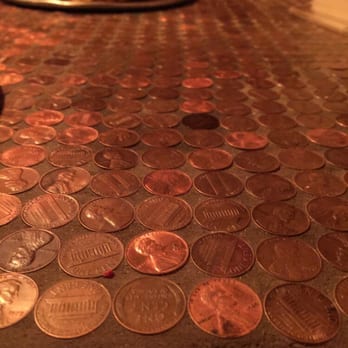 Satchel's Pizza - Our neat penny table. We tried to count the number of pennies. Got 4,176 by one method and 4,464 by another. - Pizza Near Me - Gainesville, Florida Satchel's Pizza - Our neat penny table. We tried to count the number of pennies. Got 4,176 by one method and 4,464 by another. - Pizza Near Me - Gainesville, Florida
