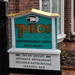 Classic Signs and Signblasters.com - Theos Taverna Pinehurst custom carved sign with vinyl graphics