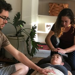 Holistic Family Doulas - Cote doing Reiki