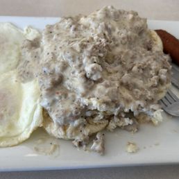 Over easy egg, biscuits and gravy with hush puppies.