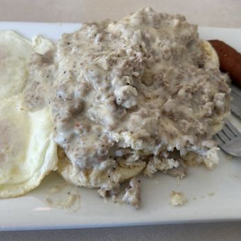 Preston's Corner Bar & Grill - Over easy egg, biscuits and gravy with hush puppies. - Seafood Near Me - Swansboro, North Carolina Preston's Corner Bar & Grill - Over easy egg, biscuits and gravy with hush puppies. - Seafood Near Me - Swansboro, North Carolina