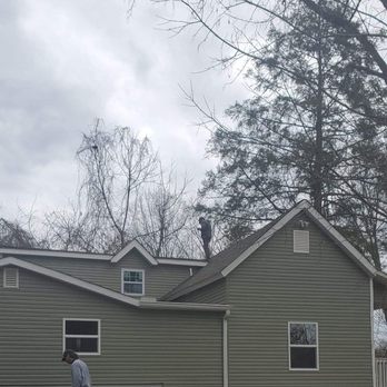 Integrity Inspection Service - Inspector Buck up on a roof - Home Inspectors Near Me Integrity Inspection Service - Inspector Buck up on a roof - Home Inspectors Near Me