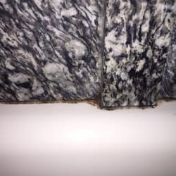 Hallmarc Inn - Black grime in bathtub