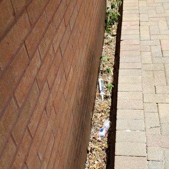 Brennan Enterprises - Debris left on neighbor's side - Windows Installation Near Me - Arlington, Texas