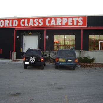 World Class Carpets - two cars parked in front of a building - Carpet Installation Near Me - London, Ontario