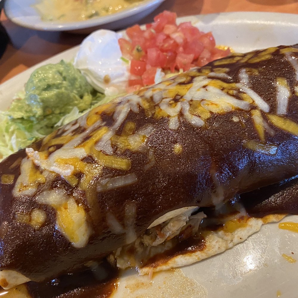 Los Molcajetes - Super burrito with mole and cheese over the top (custom, not on menu) - Mexican Near Me - Mansfield, Texas Los Molcajetes - Super burrito with mole and cheese over the top (custom, not on menu) - Mexican Near Me - Mansfield, Texas