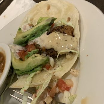 Interurban - Partially eaten fish taco dinner. Was real good with the sauce! - American Near Me - Edmond, Oklahoma