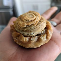 Curry puff: Puff pastry filled with potato, chicken, carrots, onion and curry powder wrapped in dough