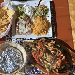 Chicken fajitas, ask for grilled more. rice beans guac sour crm, pico de gallo & corn torts Chicken fajitas, ask for grilled more. rice beans guac sour crm, pico de gallo & corn torts