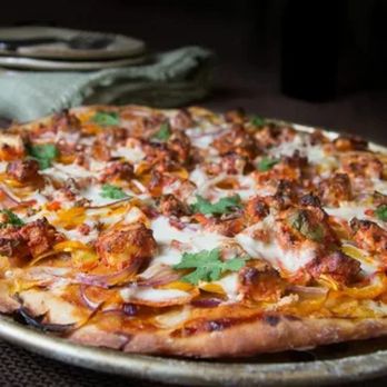 The Cheesy Bite - a pizza with meat and cheese - Pizza Near Me - Pflugerville, Texas