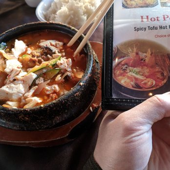 Nozomi - Complete bait and switch.  This is their seafood hot pot.   Picture had shrimps clams muscles more.  Actual dish had 1 muscle and that's it. - Sushi Bars Near Me - La Jolla, California