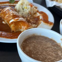 Tita’s Restaurant - Enchilada with red sauce plus beans and chips