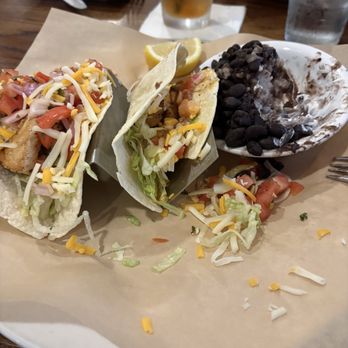 Madfish Grill - Fish tacos with black bean/ rice with sour cream. - Seafood Near Me - Sarasota, Florida Madfish Grill - Fish tacos with black bean/ rice with sour cream. - Seafood Near Me - Sarasota, Florida