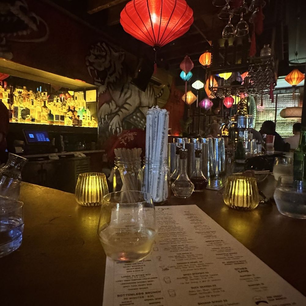 Lucky Tiger - A glass of wine at the bar - Asian Fusion Near Me - New York, New York Lucky Tiger - A glass of wine at the bar - Asian Fusion Near Me - New York, New York