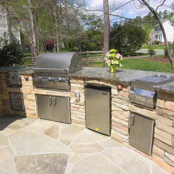 Bloomscape - an outdoor kitchen with granite counter tops - Tree Services Near Me Bloomscape - an outdoor kitchen with granite counter tops - Tree Services Near Me
