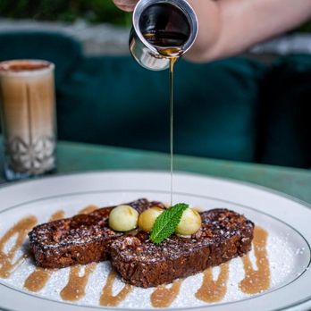 Java & Jam - a person pouring syrup over a plate of food - Breakfast & Brunch Near Me - Fort Lauderdale, Florida Java & Jam - a person pouring syrup over a plate of food - Breakfast & Brunch Near Me - Fort Lauderdale, Florida