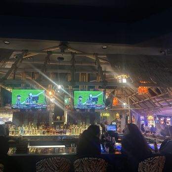The Tiki Bar - Straw thatch bar roof feature (playing sports) - Tiki Bars Near Me - Las Vegas, Nevada