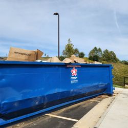 Altoview Apartment Homes - Over full dumpster