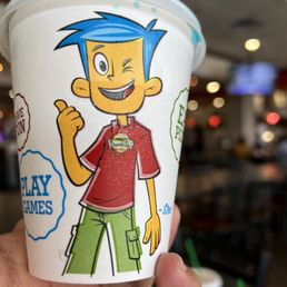 a hand holding a paper cup a hand holding a paper cup
