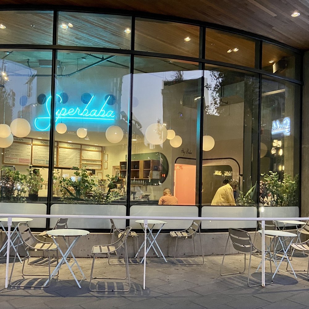 Superbaba - the outside of a restaurant with tables and chairs - Middle Eastern Near Me - Victoria, British Columbia Superbaba - the outside of a restaurant with tables and chairs - Middle Eastern Near Me - Victoria, British Columbia