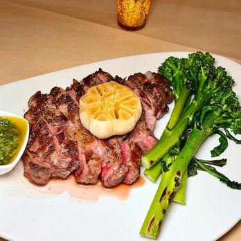 The Consulate - Grilled Ribeye with broccolini and chimichurri sauce - French Near Me - New York, New York The Consulate - Grilled Ribeye with broccolini and chimichurri sauce - French Near Me - New York, New York