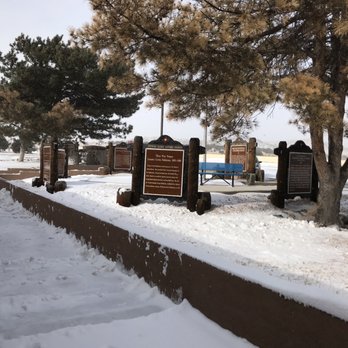 La Bajada Rest Area - Outdoor scene at La Bajada Rest Area in Santa Fe, NM, featuring snow-covered ground, trees, and informational plaques. - Rest Stops Near Me - Santa Fe, New Mexico