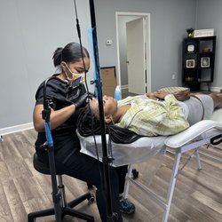 UB Brow Bar - Artist working on clients eyebrows
